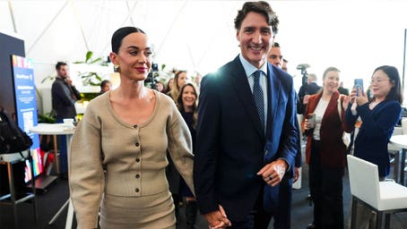 Katy Perry, Justin Trudeau hold hands during appearance at World Economic Forum in Davos