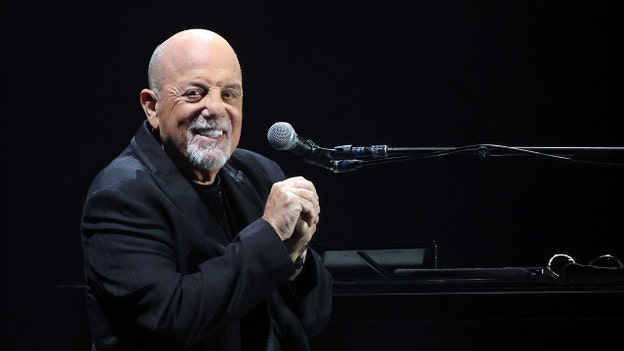 Billy Joel playing piano