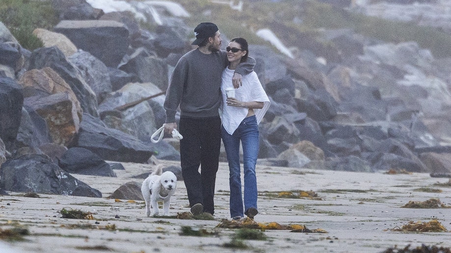 split by side of Nicola and Brooklyn Beckham taking a walk on the beach.