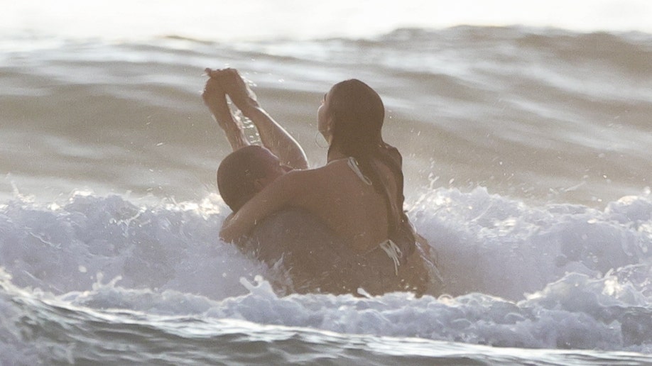 Channing Tatum carried girlfriend, Inka Williams, as the two swam in the ocean.