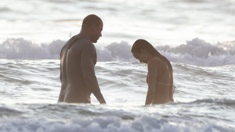 Tatum and Williams cooled off in the ocean while on vacation in Costa Rica.