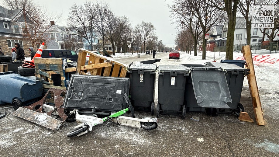 Location of ICE shooting barricaded by residents in Minneapolis