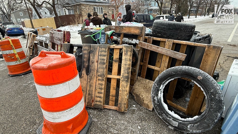 Location of ICE shooting barricaded by residents in Minneapolis