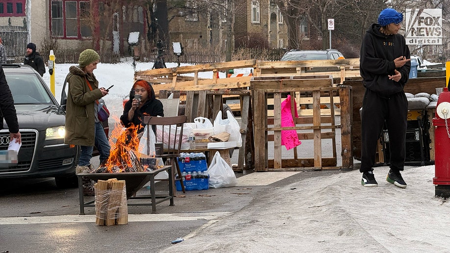 Location of ICE shooting barricaded by residents in Minneapolis