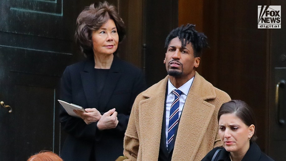 Jon Batiste leaving the funeral.