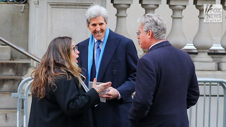John Kerry speaks to people outside Tatiana Schlossberg's funeral.
