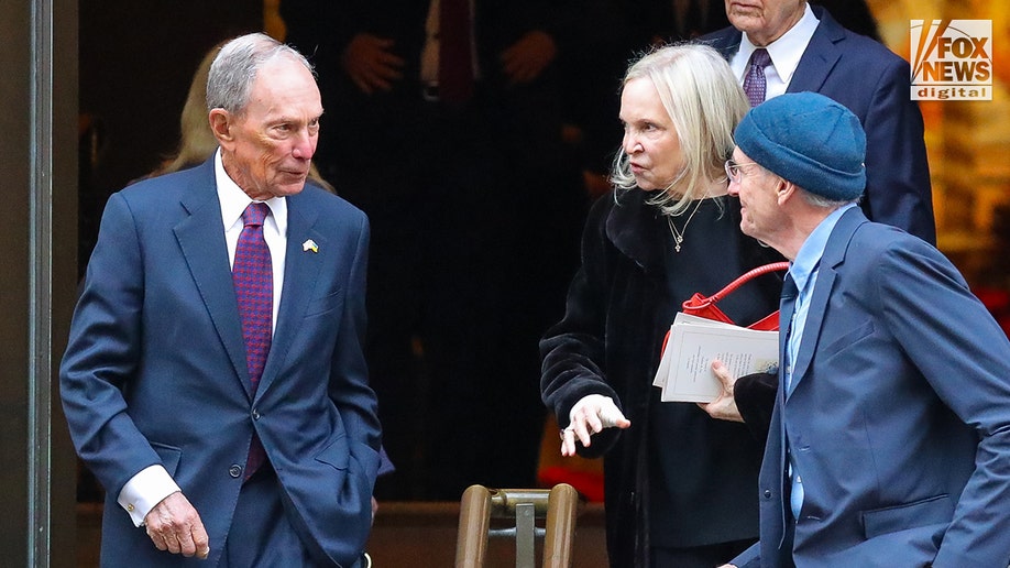 Michael Bloomberg and Kerry Kenedy leaving the funeral.