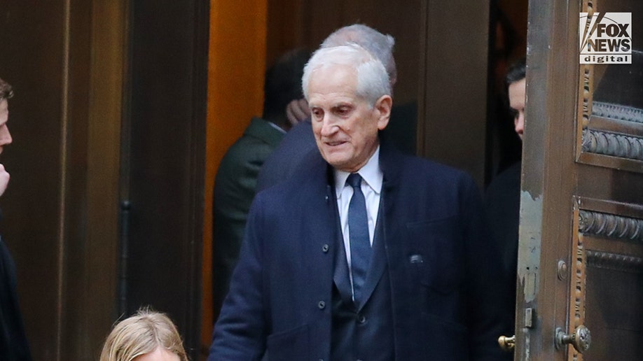 Tatiana Schlossberg's father leaves her funeral in New York.