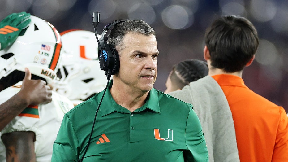Miami coach Mario Cristobal wrestles out of hug after Carson Beck's touchdown in viral moment