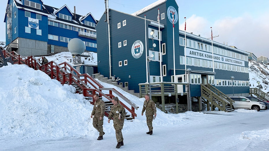 Danish soldiers walk past a military headquarters building in Greenland’s capital.