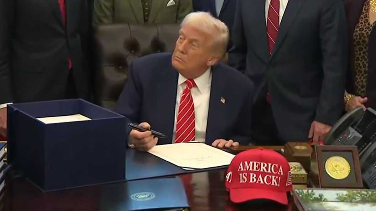 An "America is Back!" hat is seen on the resolute desk, Tuesday, Feb. 3, 2026, after President Donald Trump signed legislation ending the partial government shutdown that began late last week.