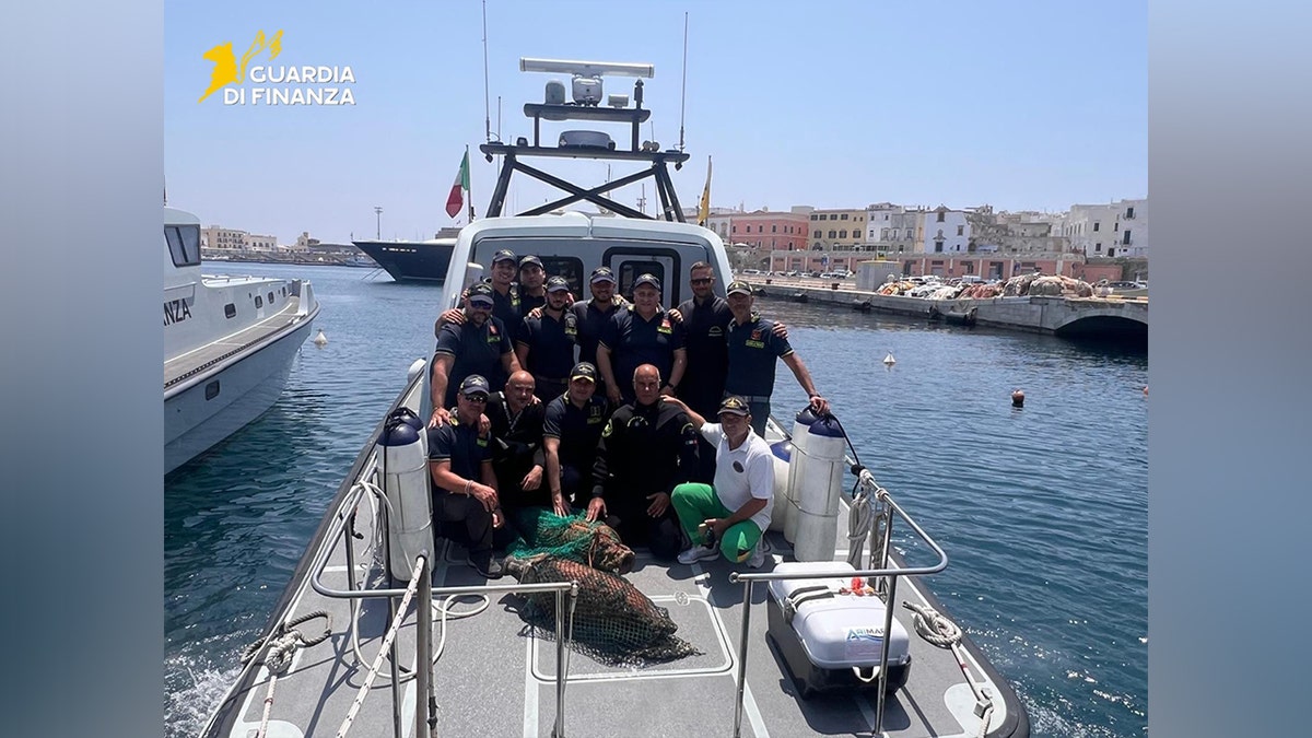 Italian police posing on boat