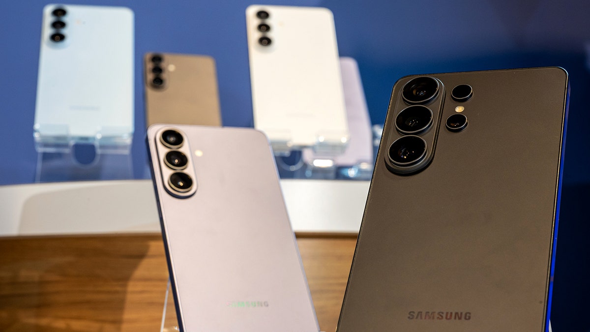 Samsung phones sit on display.