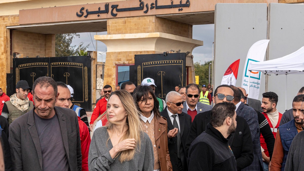 Angelina Jolie standing at the Rafah border crossing between Egypt and the Gaza Strip.