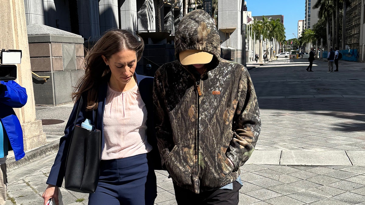 Anna Kepner’s stepbrother and his attorney walking outside of a Federal Court building in Miami.