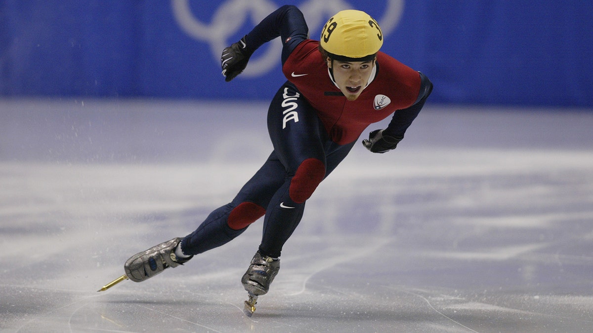 Short track speed skater Apolo Ohno competing in 2002 Salt Lake City Olympics.