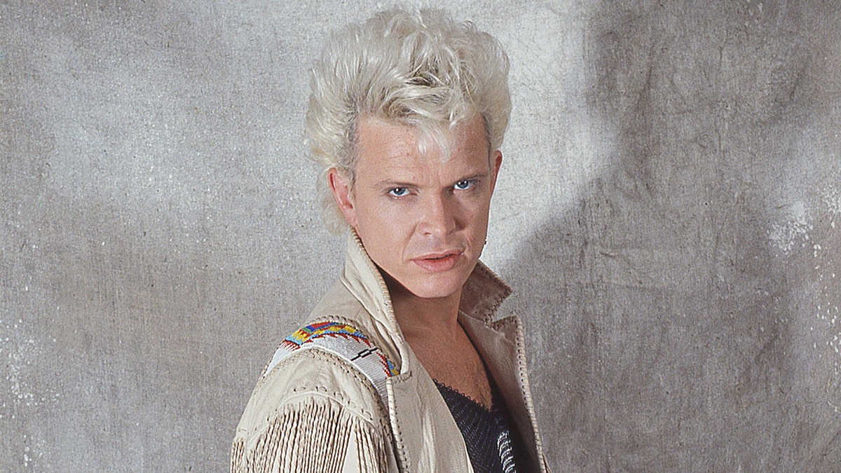 Billy Idol posing for photos in Italy in 1990.