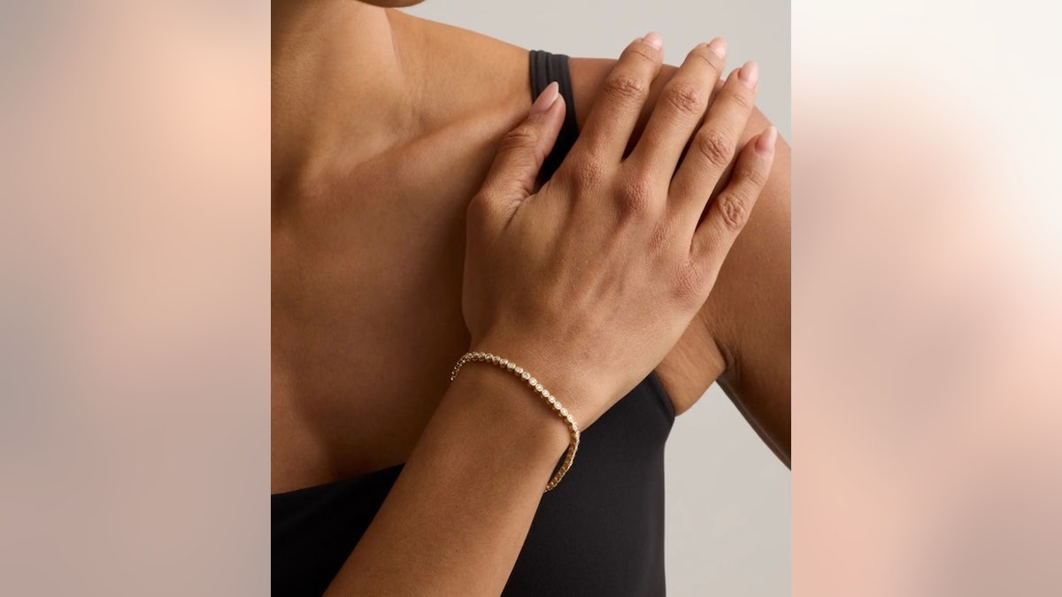 This bezel-set tennis bracelet has a clean profile.