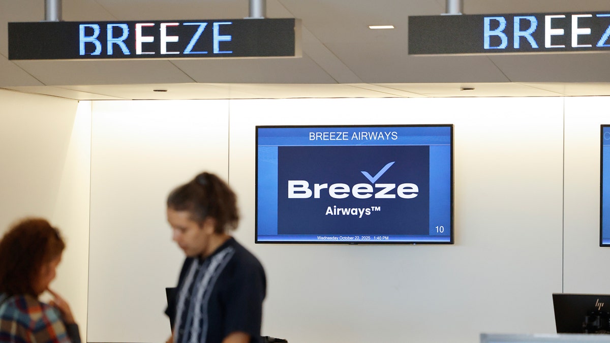 breeze airway sign at airport people checking in