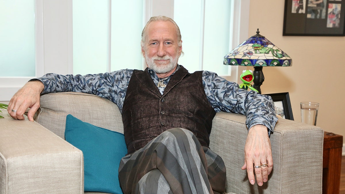 Brian Henson sitting on a couch in California.