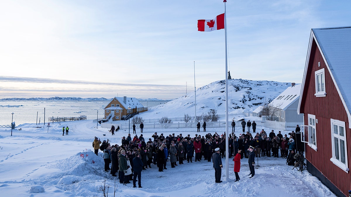 Canadian flag being raised in Greenland