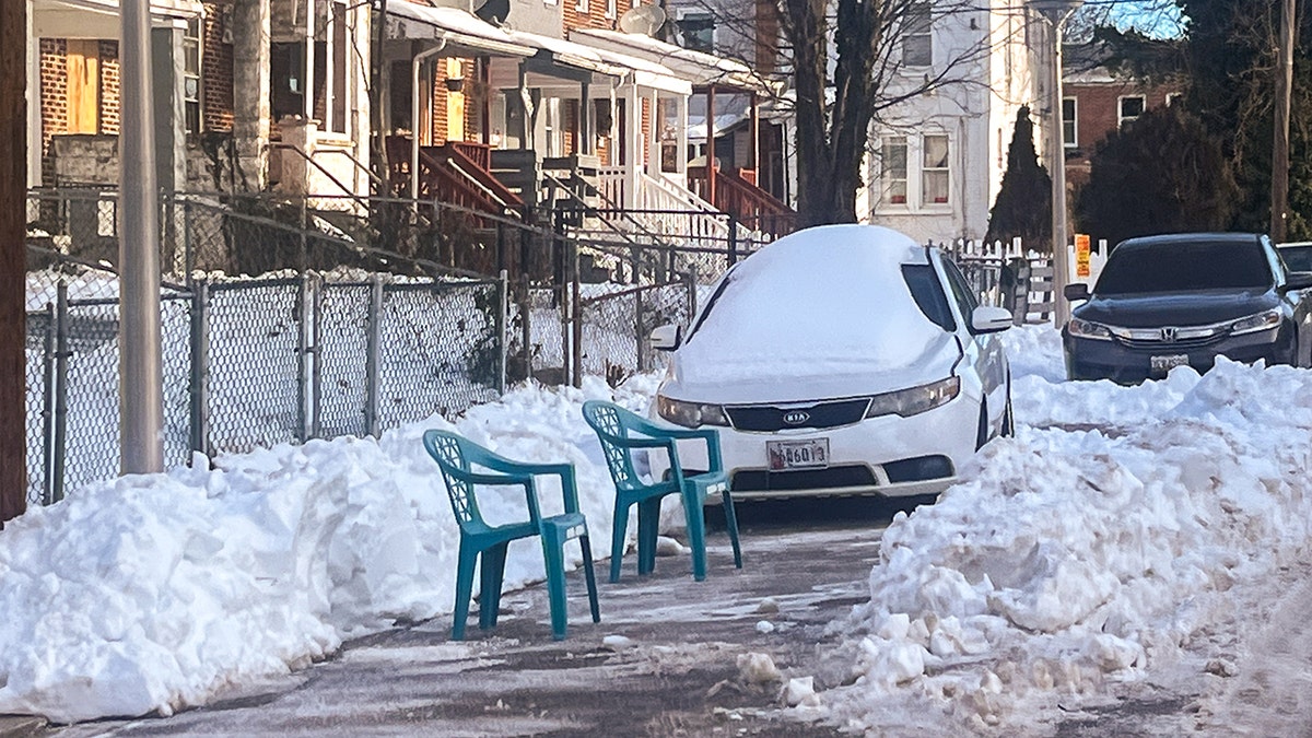 Using chairs to save spaces after snow in Baltimore