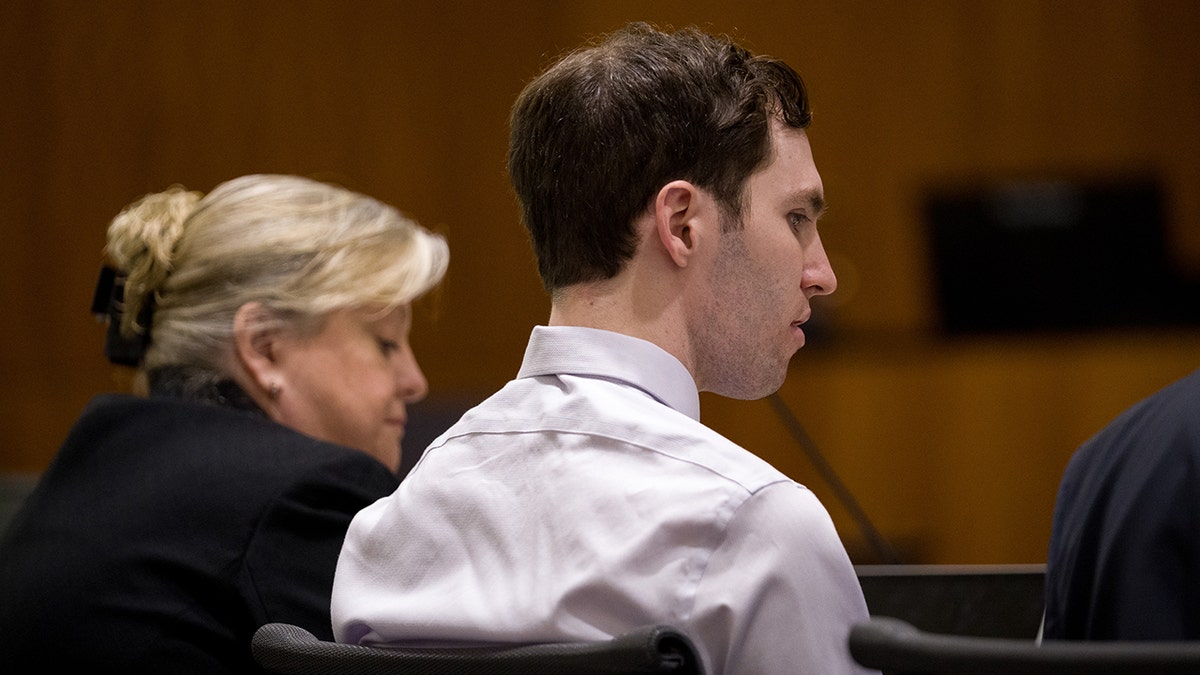 Tyler Robinson appearing in a courtroom for a hearing.