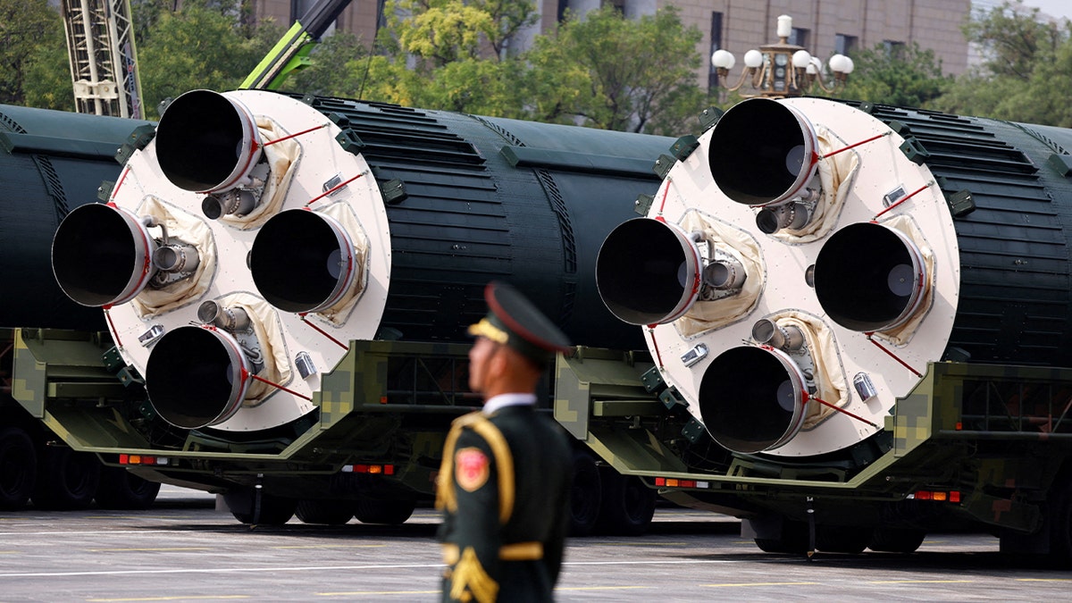 A member of the People's Liberation Army stands as the strategic strike group displays DF-5C nuclear missiles during a military parade to mark the 80th anniversary of the end of World War Two, in Beijing, China, September 3, 2025