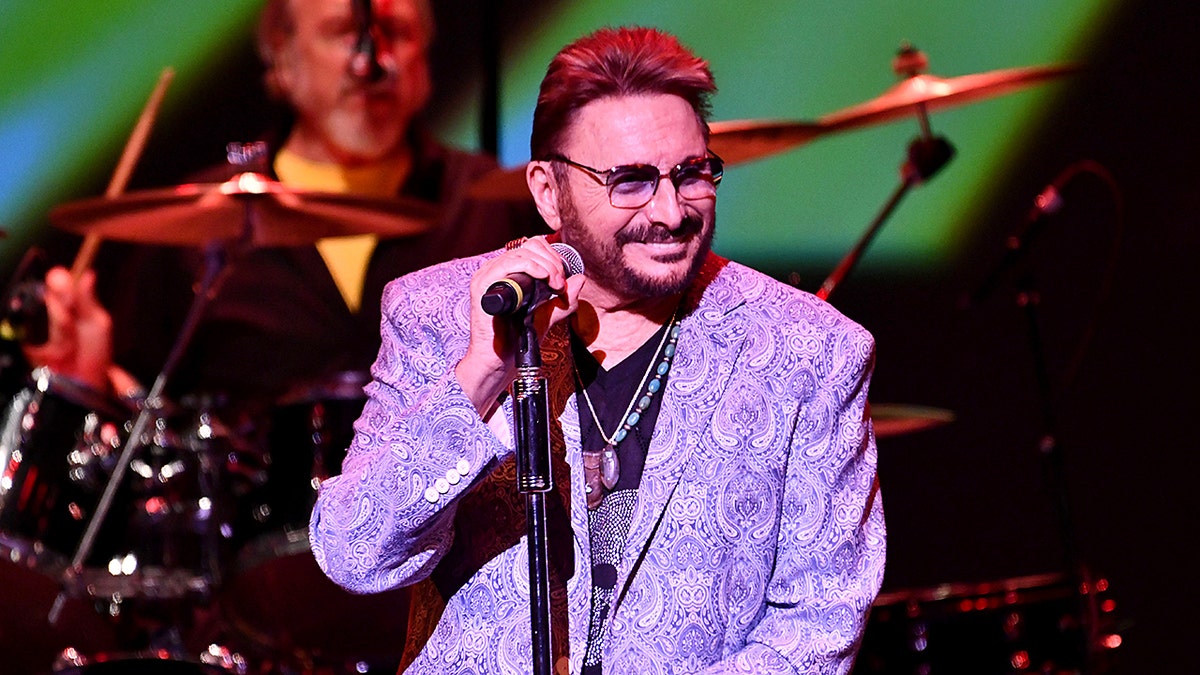 Chuck Negron performing onstage