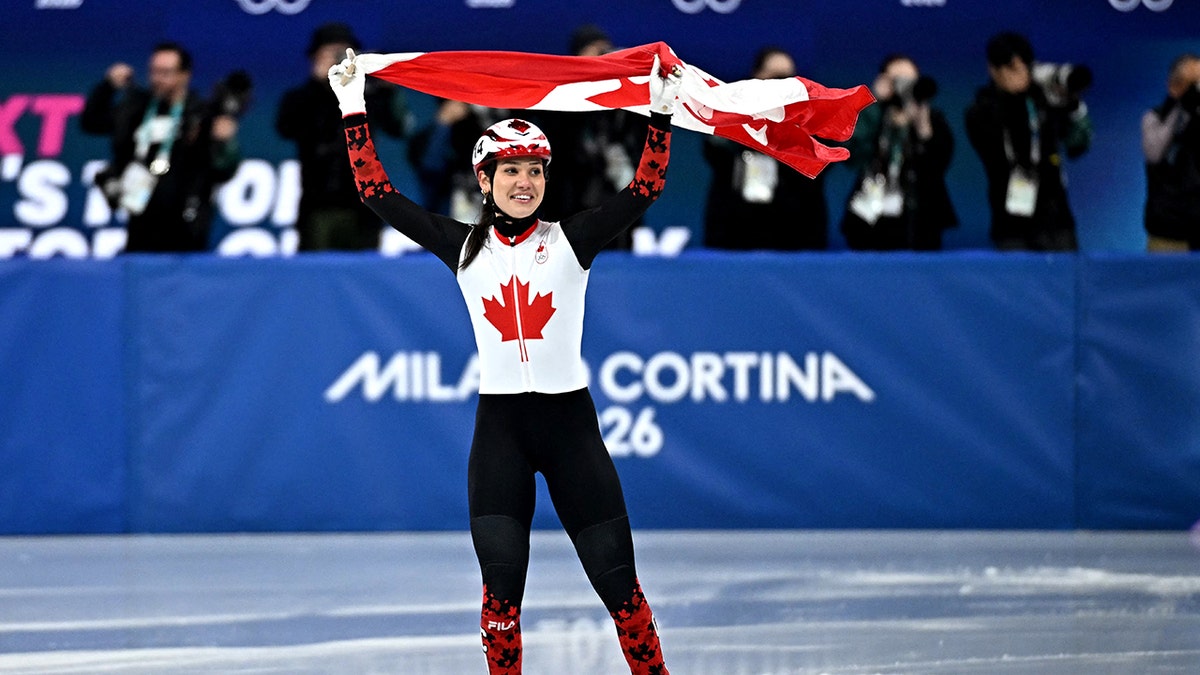 Sarault holding Canadian flag