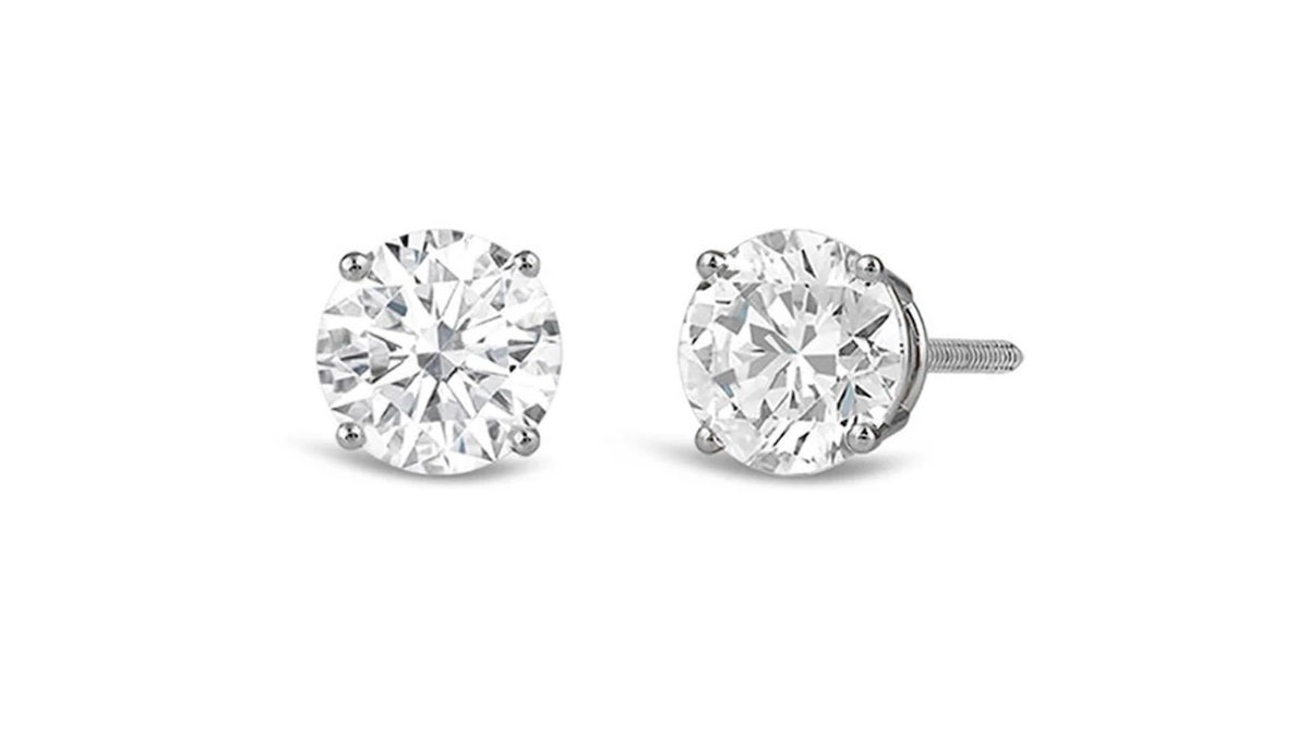 Classic 1/2-carat diamond studs in a four-prong setting.