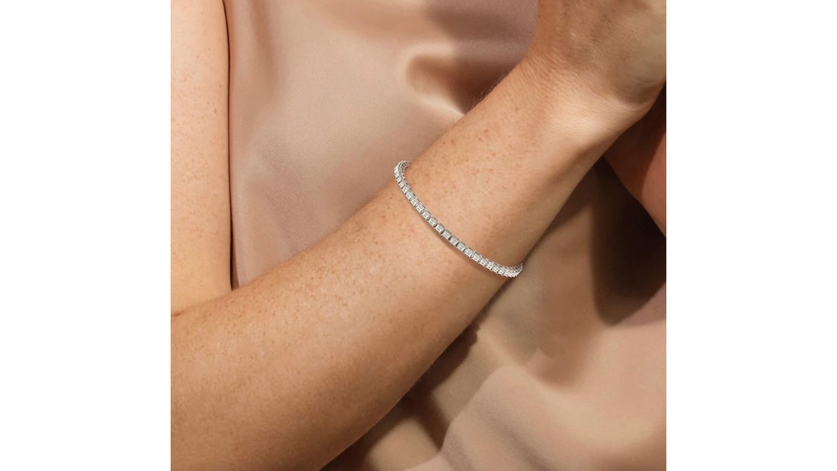 Emerald-cut diamonds set horizontally for a modern look.