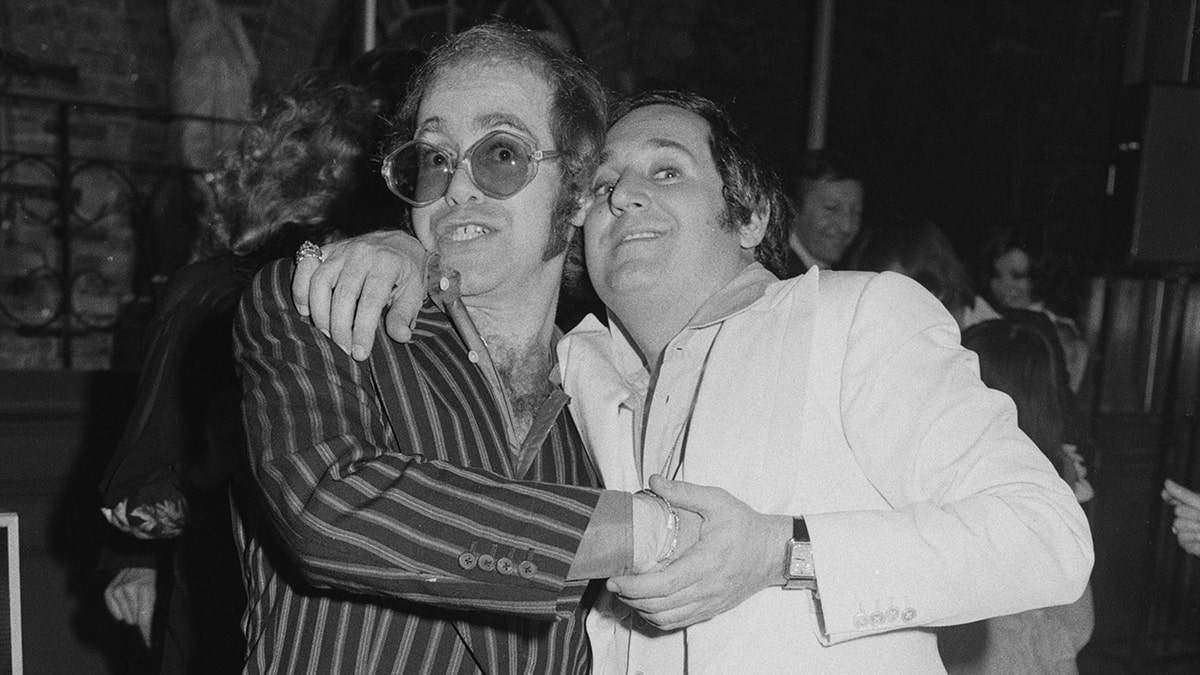 Elton John and Neil Sedaka at a reception in February 1975.