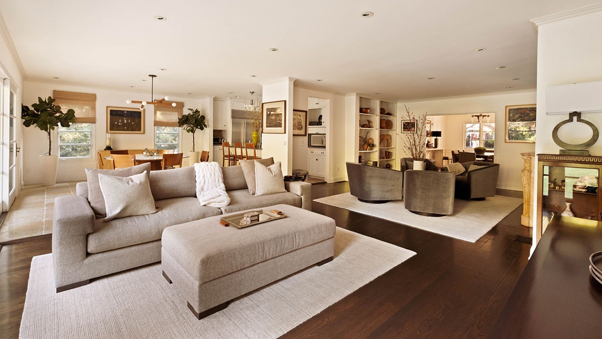 The family room also features a TV and is connected to the casual dining area.