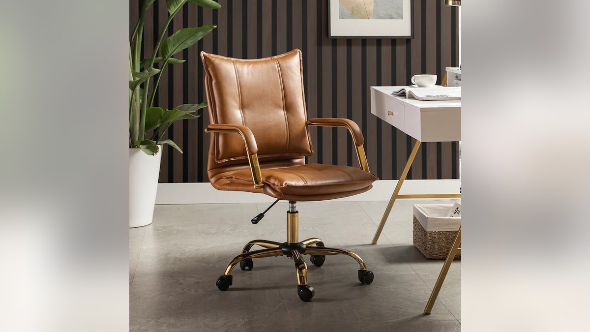 Swivel all the way around in this faux leather chair.