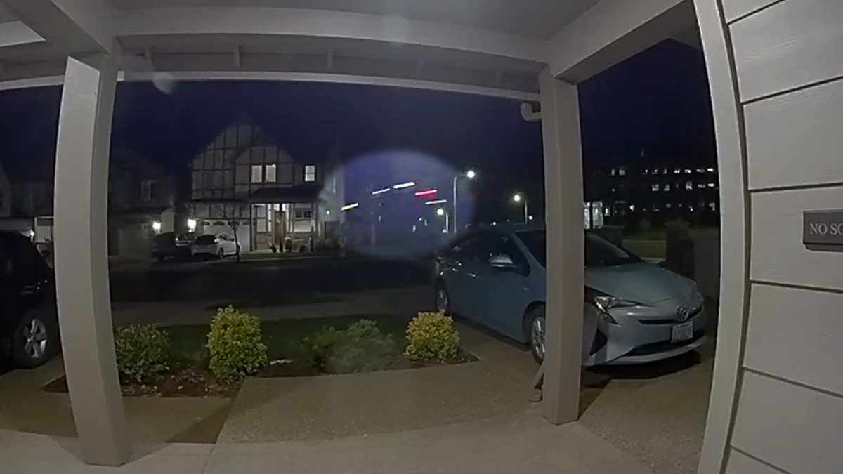 A truck is in mid-air, just about to hit a house.