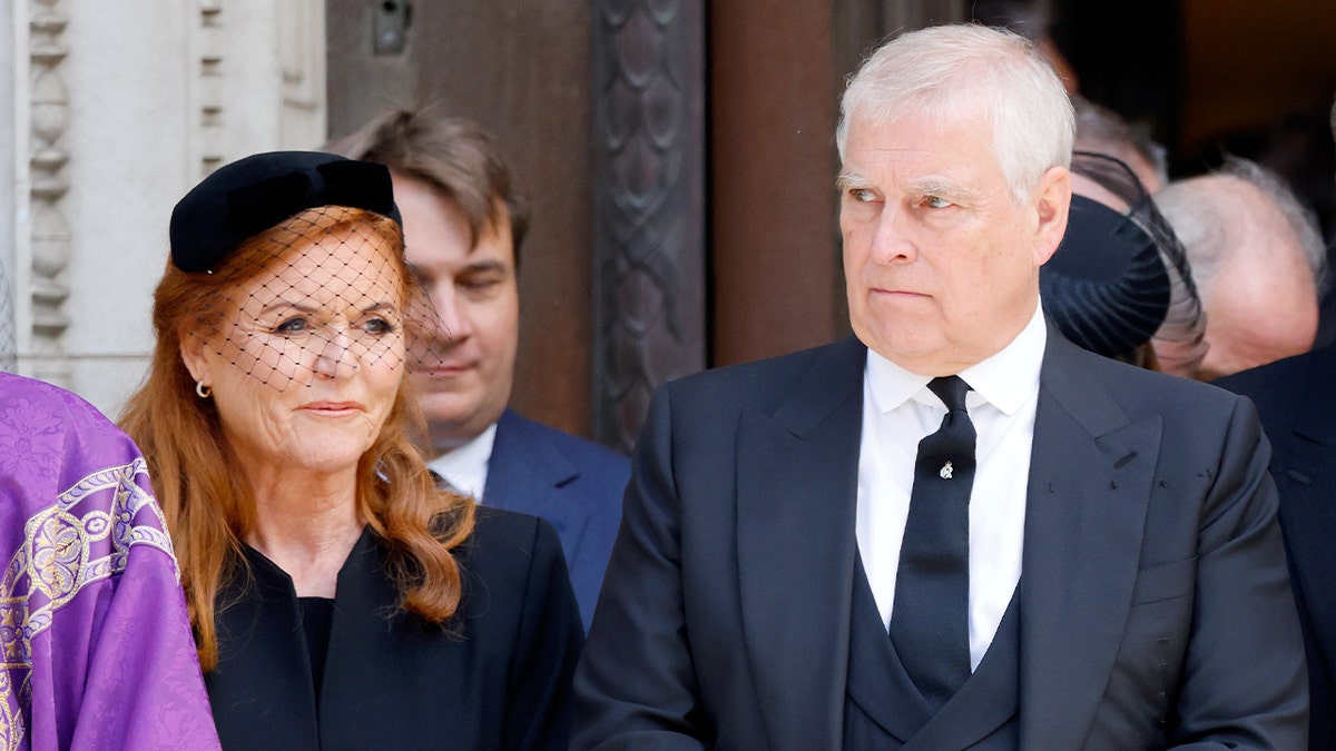 Sarah Ferguson and Prince Andrew arrive at Westminster Cathedral for a memorial service, dressed in dark formal attire.