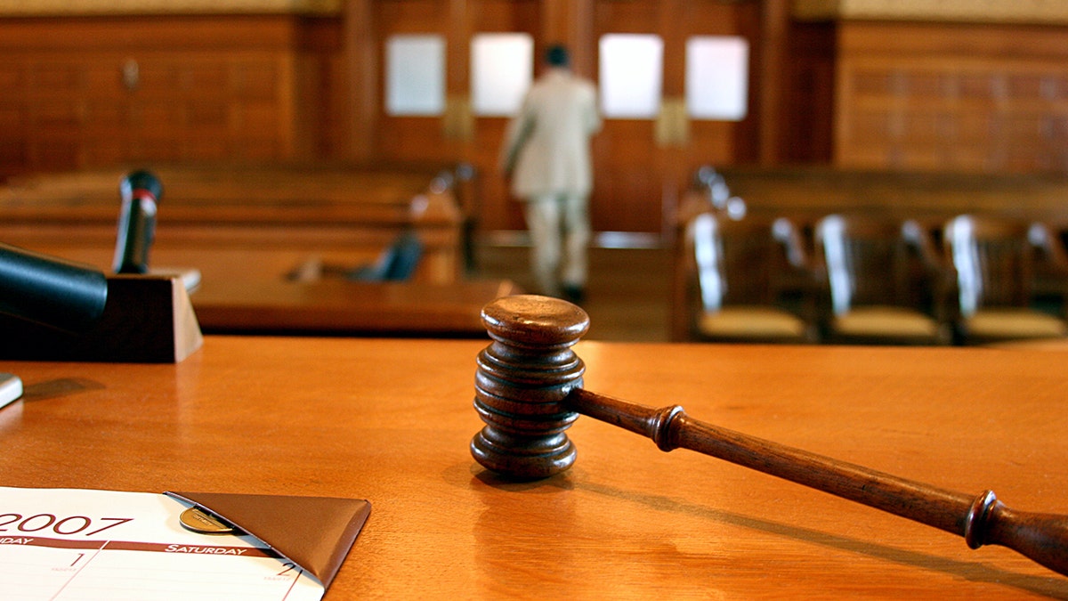 Hammer on the bench as people leave court