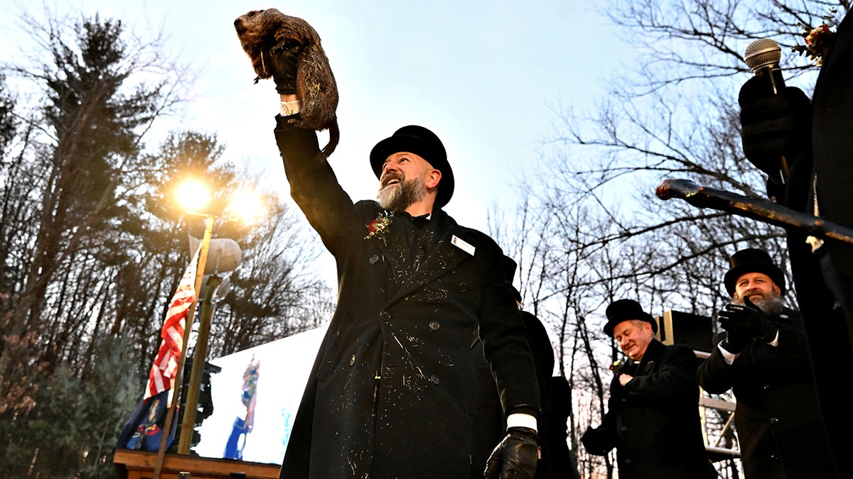 Groundhog Club handler A.J. Dereume holds Punxsutawney Phil
