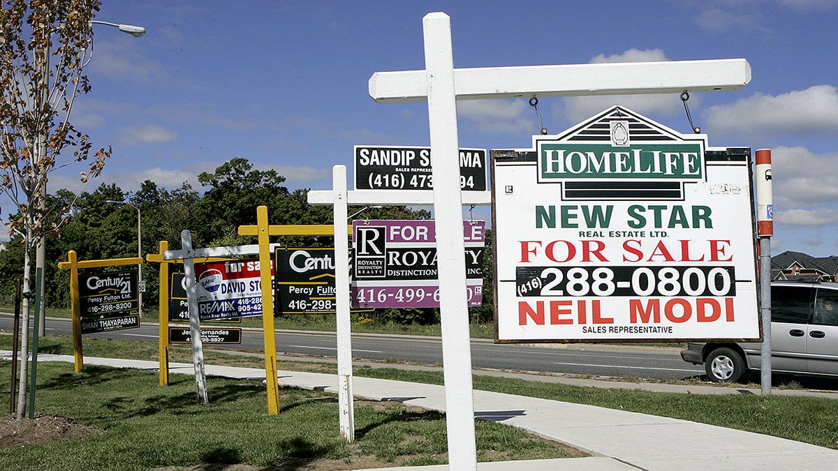 A row of for sale signs