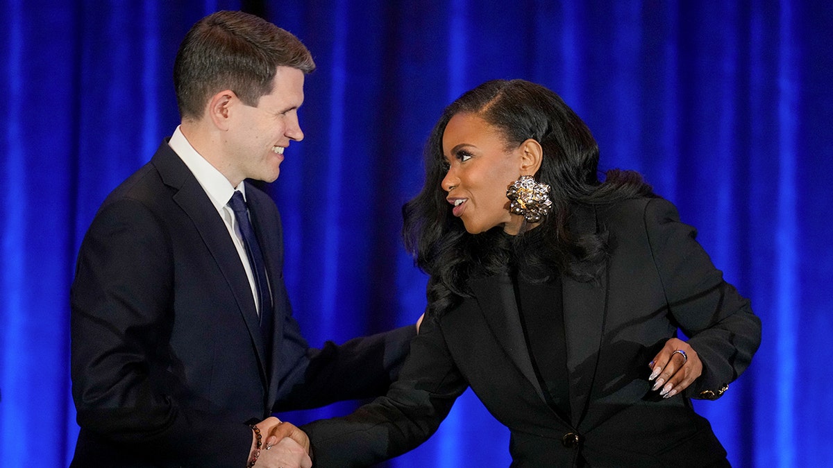 James Talarico and Jasmine Crockett shake hands