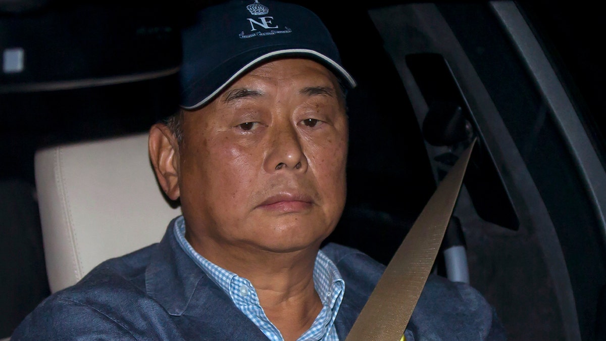 Jimmy Lai is in the car.