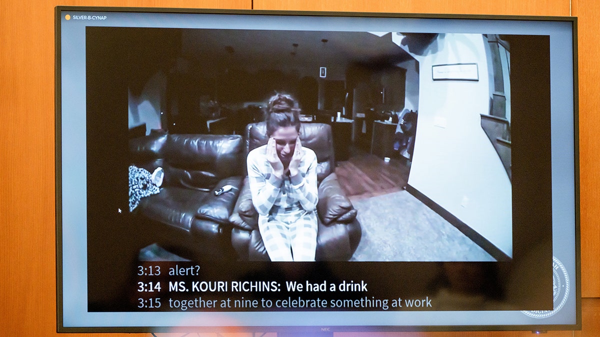 Body camera video of Kouri Richins being displayed on a monitor in a courtroom.