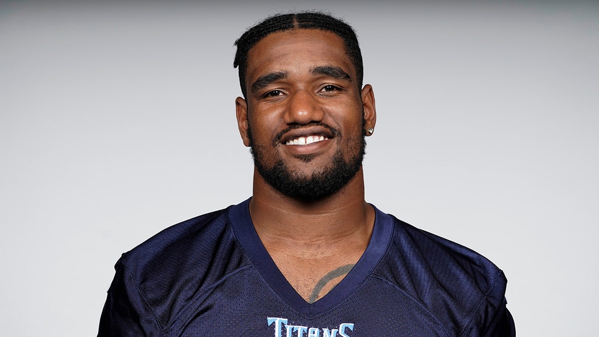 LaTroy Lewis wearing a Tennessee Titans jersey