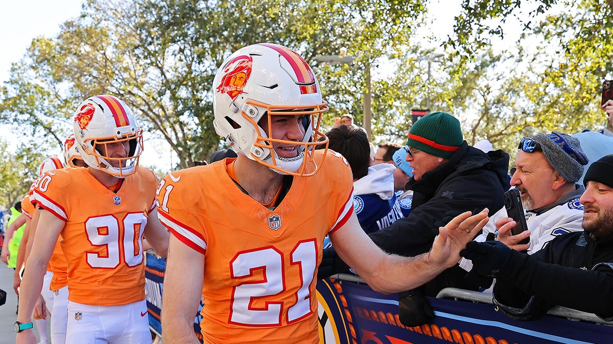 Chargers players greet fans in Buccaneers uniforms