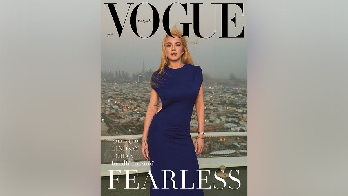 Lindsay Lohan on the cover of Vogue Arabia in a blue dress.