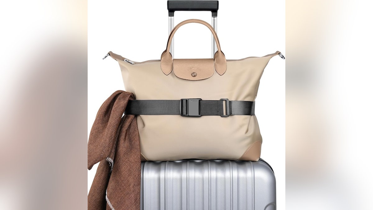 Put an end to bag juggling and secure everything to your suitcase.