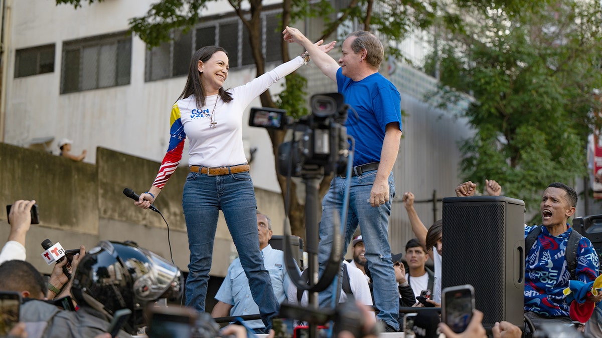 María Corina Machado and Juan Pablo Guanipa join demonstrators during an anti-government protest in Caracas.