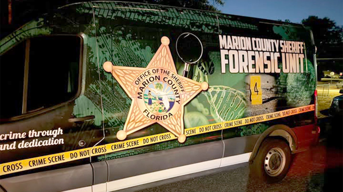 A Marion County Sheriff Forensic Unit van parked at night.