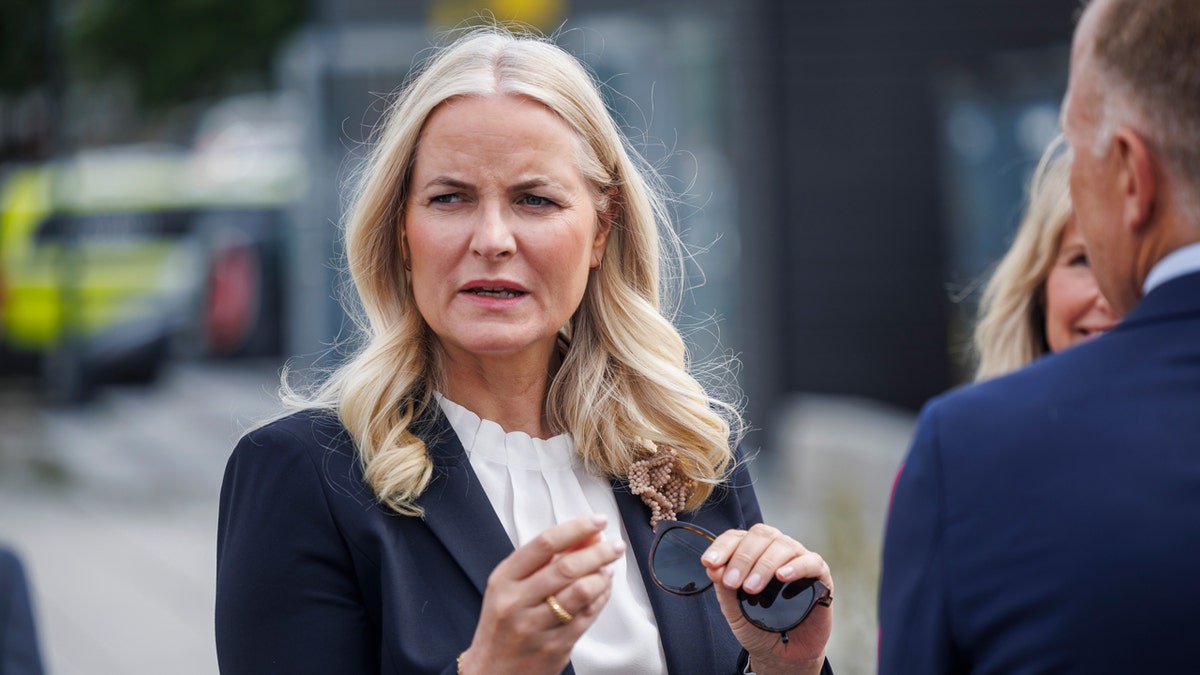 Crown Princess Mette-Marit participating in the laying of a foundation stone.